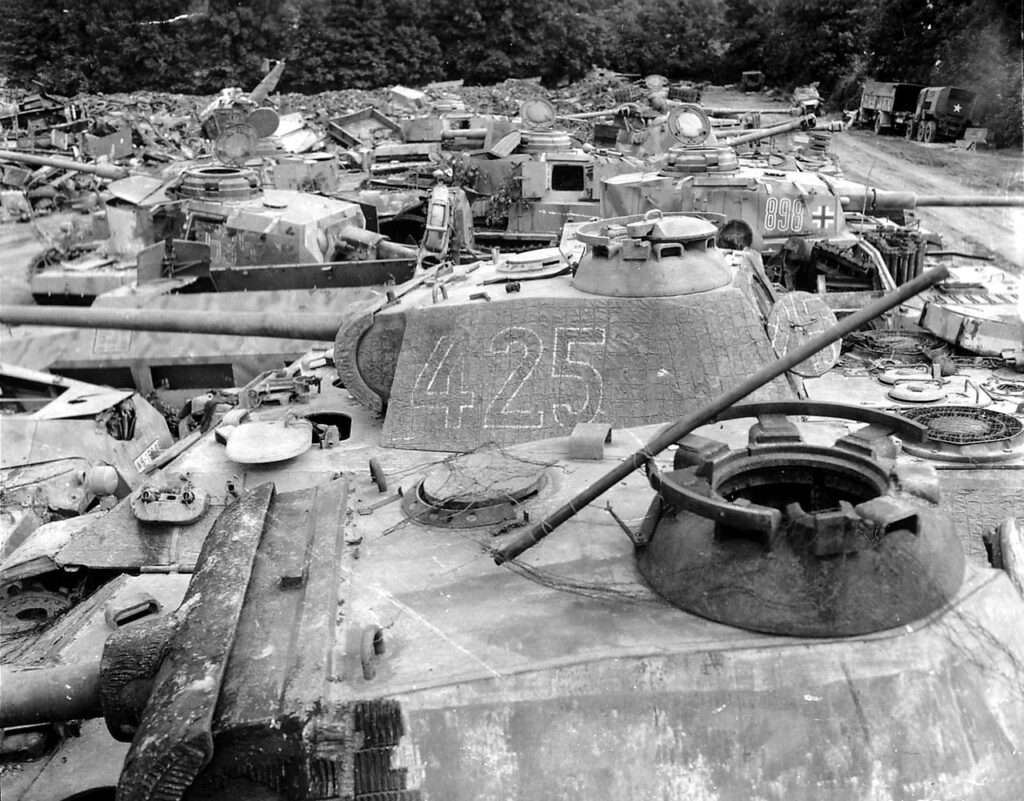Captured Panther tanks among Pzkfw IV Panzers - all on an Allied collection area in Normandy, summer of 1944.