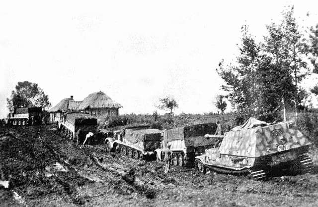 A Panzerjäger Ferdinand and a column of Sdkfz 9 (Famo) half tracks deeply stuck in the mud on the Eastern Front.