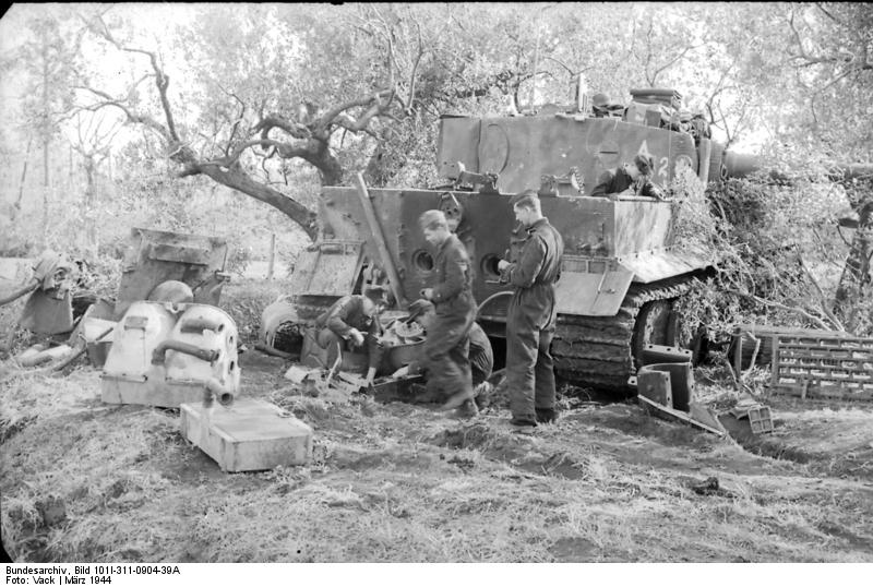 German soldiers cannibalizing a Pzkfw VI Tiger
