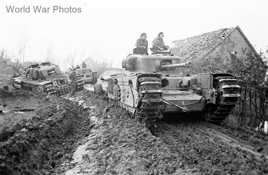 Churchills, Mk VII variant in 1944 or 1945 on a muddy road in WW2<a href="https://www.worldwarphotos.info/wp-content/gallery/uk/british-tanks/churchill-a22/Churchills_VII_44-45.jpg" rel="nofollow"> Source</a>