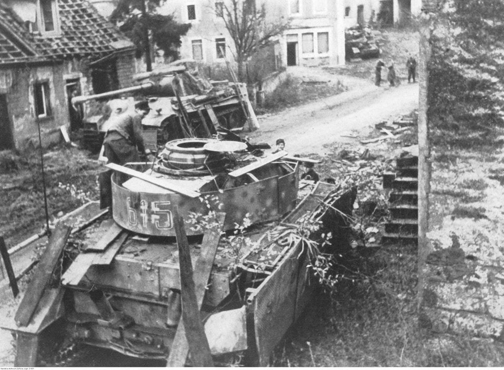 PzKpfw V Panther tank and Panzer IV german tanks unit stationed in a village in the Vosges Mountains. Date December, 1944.