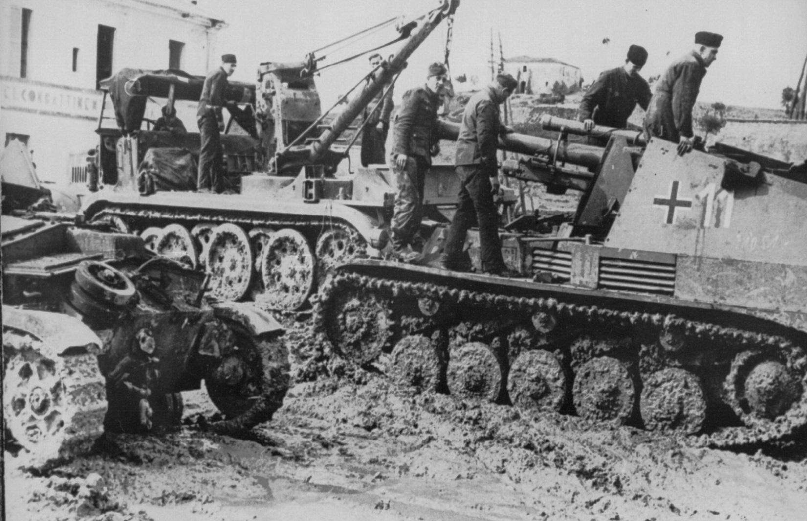 Sd.Kfz. 124 Wespe Self-Propelled Gun underwent maintenance in challenging muddy conditions in 1944, Italy.